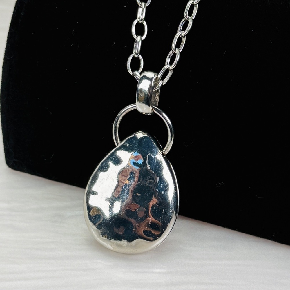 Beautiful Silvertone hammered pendant, long costume necklace